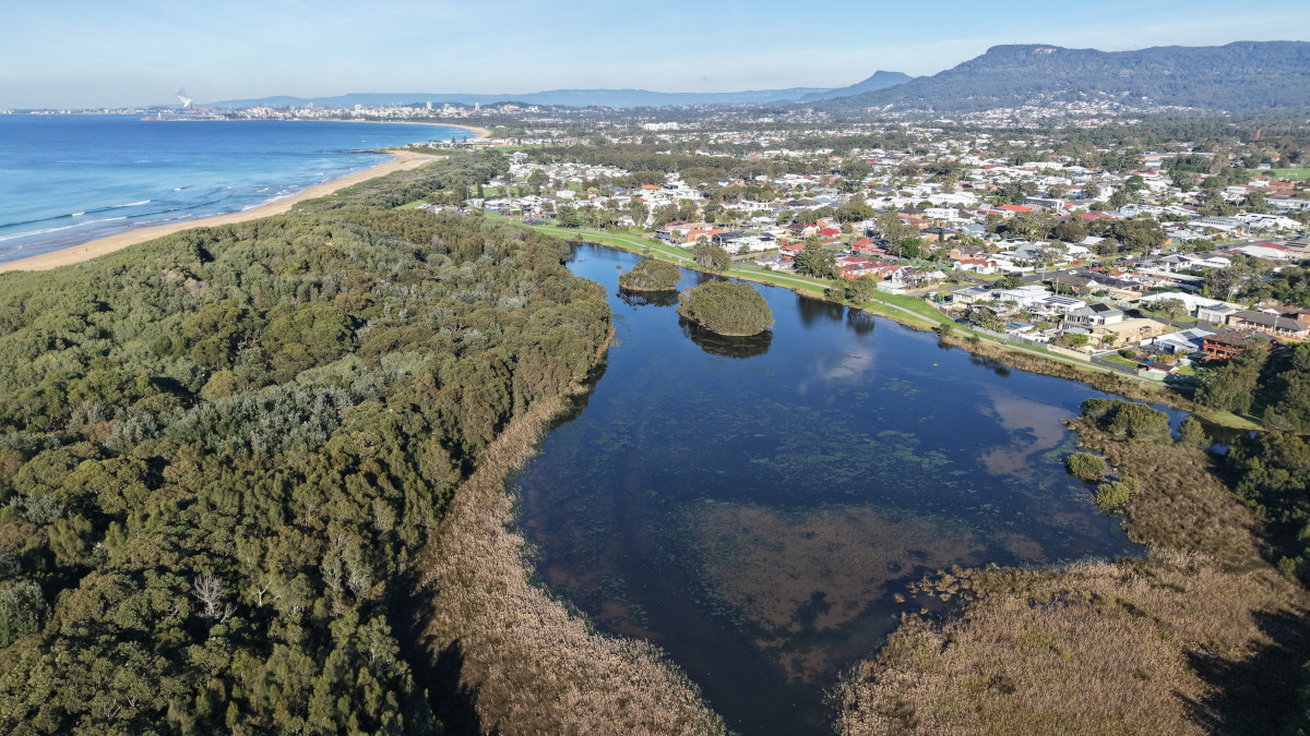 Aerial view of Bellambi Lagoon, the coastline and Illawarra escarpment on the Thirroul to Wollongong Coastal Ride.