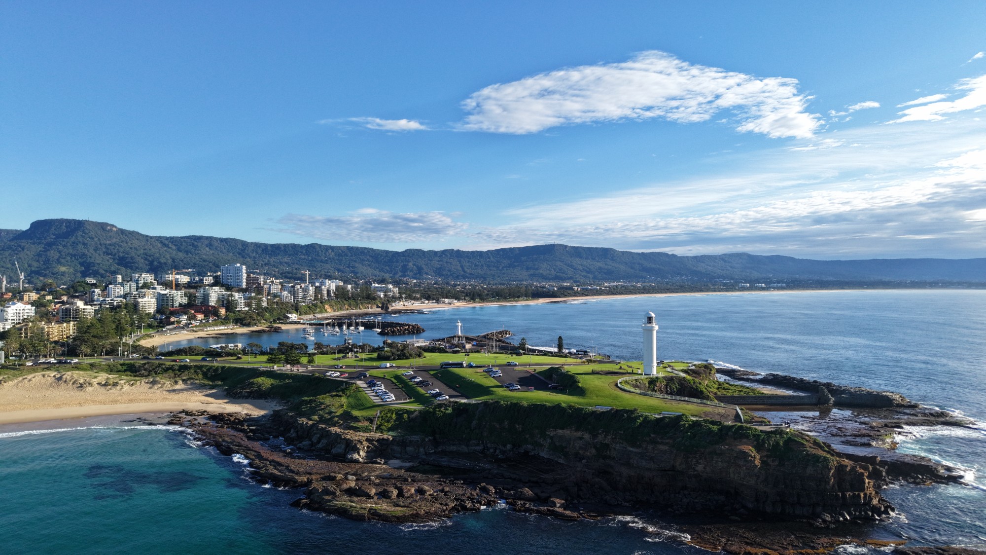 Aerial view of Wollongong Harbour, Flagstaff Point lighthouse and the Illawarra Escarpment