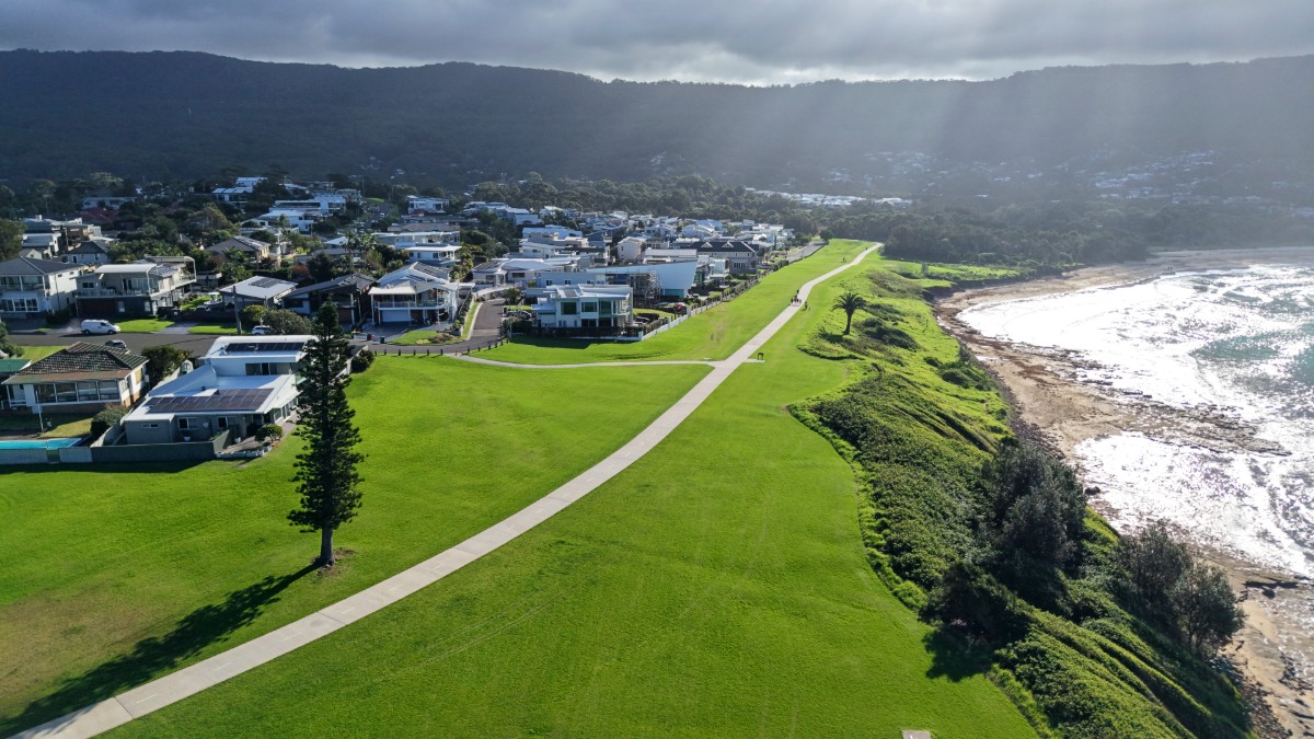 Aerial view of the shared coastal pathway at Sandon Point with ocean views and the Illawarra Escarpment in the background
