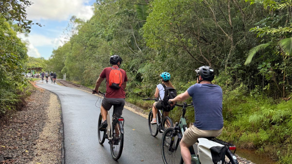 Two people riding ebikes on the Northern Rivers Rail Trail