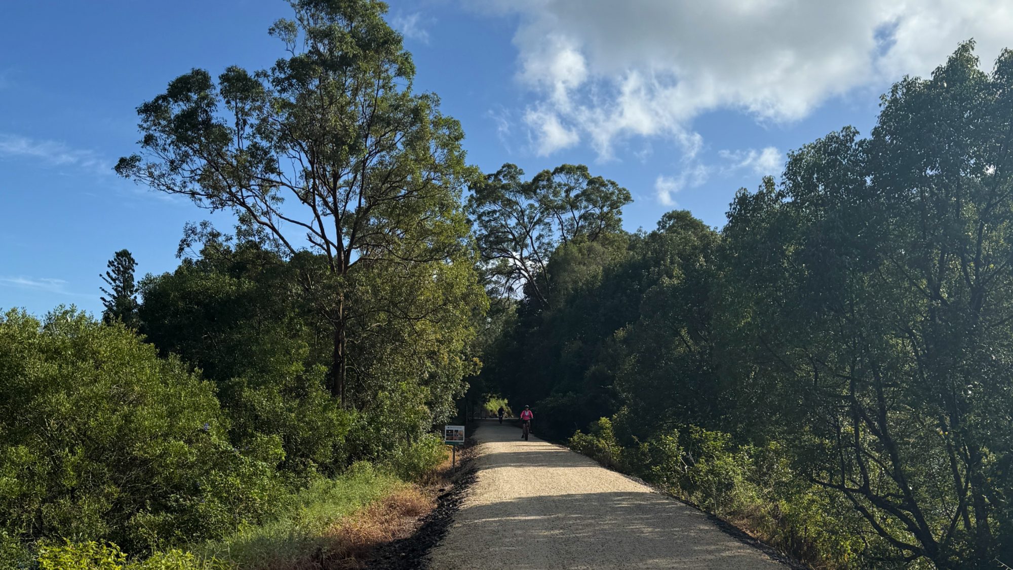 Cyclists riding the Northern Rivers Rail Trail through the North Coast NSW hinterland